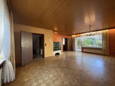 Wohnzimmer mit Kachelofen Haus