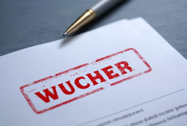 Ein Dokument ist rot mit "Wucher" abgestempelt.
