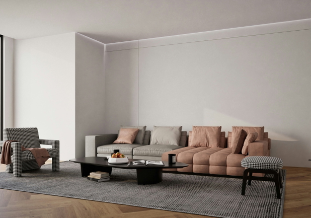 Ein modernes Wohnzimmer mit einer grau-braunen Couch und weißen Wänden.