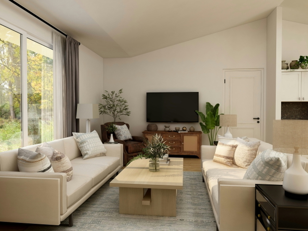 Zwei weiße Sofas und daszwischen ein Couchtisch, im Hintegrund ein Fernseher und Pflanzen.